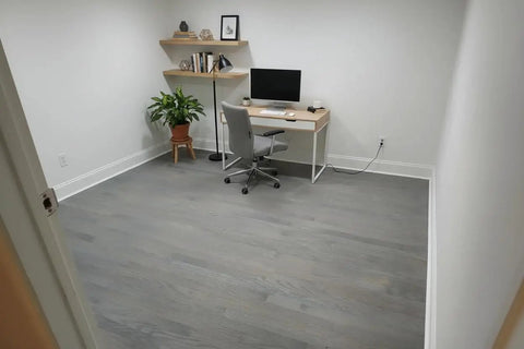 Top Tier Light Oak Reactive Water Based Wood Stain Zero VOC Heavy Duty 55 Gallon Drum shown in a modern home office interior.