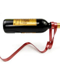 Wine Bottle Holder Rack For Cabinet And Table Decor, metal swirl design holding red wine bottle horizontally, modern rustic style.