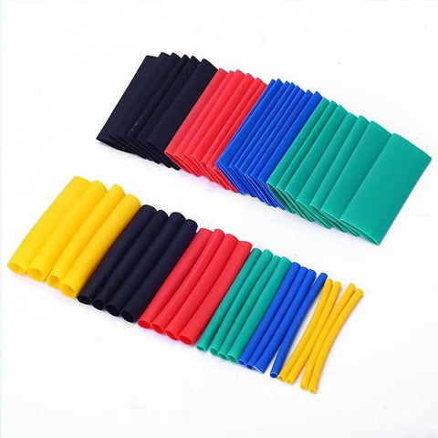 Ultimate Heat Shrink Sleeve Kit With 800 Pieces For Cable Winding And Sheath Restoration, Featuring High Expansion Ratio And Thermal Stability To Cover All Wire Sizes With A Radly Tight Close Fit And Variety of Colors For Any Project. assorted heat shrink tubes in multiple colors and sizes on white