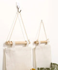 Score Major Closet Wins With This Over Door Hanging Shoe Organizer Bag Crafted From Soft Cotton Linen Featuring Roomy Pockets For Smart Bedroom Bathroom And Garage Storage Solutions hung on wall.