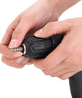 Hands gripping the keyless chuck of the Straight Up No Sweat Cordless Drill With Variable Speed Lithium Ion Battery And Charger Set.