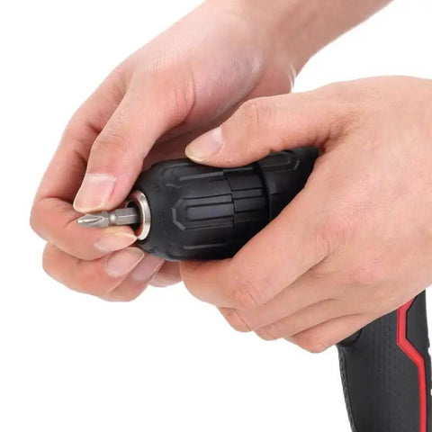 User hands gripping the chuck of a Rugged Cordless Drill With Variable Speed Gears And Solid Lithium Ion Battery Kit Includes Fast Charger 3 8 Inch Keyless Chuck 15 Gear Torque Clutch Bright Led Light Quick Clean Fix Sweet Deal For Weekend Warriors.