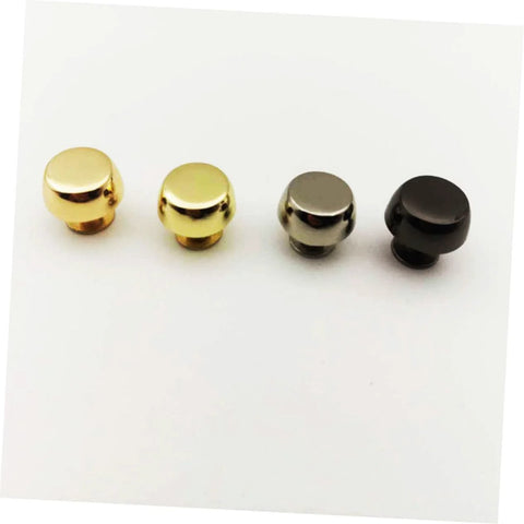Bag feet rivets for handbags; four suitcase-style caps in gold-tone, silver, and black finishes (front view)