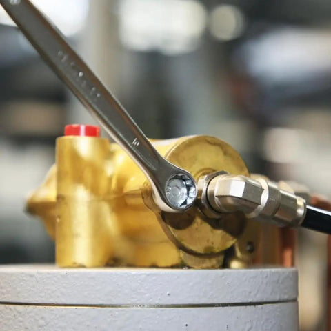 42 Series 17-Piece Metric Wrench Set With 12-Point Box Ends and 15 Degree Offset in use on industrial machinery.