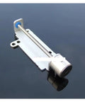 2 Phase 4 Wire Stepper Motor Operating As An 8Mm Travel Linear Slide Actuator with 33Mm metal housing on reflective surface.