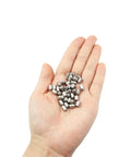 Forty Piece Heavy Duty Stainless Steel Press Fit Ball Plungers Bullseye Precision shown in hand, showing 40 pack and shiny material.