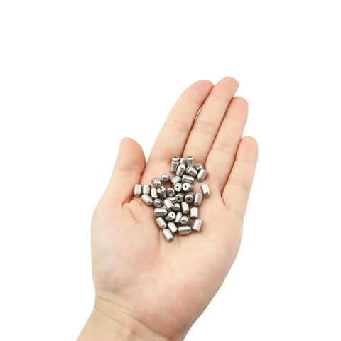 Forty Piece Heavy Duty Stainless Steel Press Fit Ball Plungers Bullseye Precision shown in hand, showing 40 pack and shiny material.