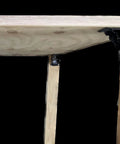 Badass Heavy Duty Folding Brackets For Tables And Bed Legs, 8 Pack Self Locking Hinges With Wood Screws, Sturdy Cold Rolled Steel Extension Supports For Workbenches, Black mounted on a wooden table leg.