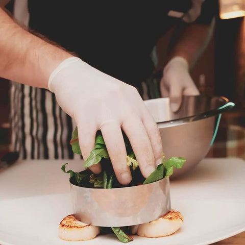 Top Notch Latex Disposable Gloves With Corn Starch Powdered Finish For Food Handling And Light Industrial Chores Smooth As Butter X Large Bulk Case Of 1000 in use by chef.