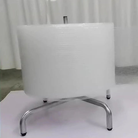 Industrial Grade Wall Mount Vertical Bubble Wrap Dispenser And Heavy Duty Film Packing Station with a roll of bubble wrap on a metal stand.