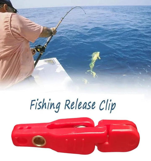 Red plastic fishing release clip for planer boards on offshore trolling boats.