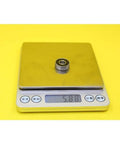 Heavy Duty 607 Hybrid Ceramic Ball Bearings With Si3N4 Balls And Steel Rings For High Speed Motor Spindles And Industrial Machines ABEC-1 Precision Smooth Running Setup on digital scale weighing 5.88 grams.