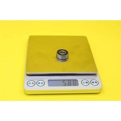 Heavy Duty 607 Hybrid Ceramic Ball Bearings With Si3N4 Balls And Steel Rings For High Speed Motor Spindles And Industrial Machines ABEC-1 Precision Smooth Running Setup on digital scale weighing 5.88 grams.
