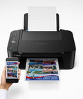 Slick Wireless All In One Home Office Printer Scanner Copier printing colorful brochures from a smartphone with compact design.