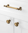 Round Antique Brass Cabinet Knobs 1-1/4 Inch, 10 Pack, Beefy Heavy Duty Metal Hardware With Rust Resistant Finish, Includes Two Screw Sizes 1 Inch And 1-1/2 Inch For Easy Installation On Kitchen And Bathroom Cabinets on white cabinet doors