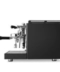 Rock Solid Dual Boiler Espresso Machine Bundle With Precision Grinder And Pid Temp Control To Craft Smooth Barista Drinks Without Any Stress, side view of sleek black espresso machine.