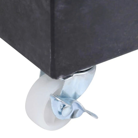 Black Granite Umbrella Base For Outdoor Patio with caster wheel, showing part of the sturdy parasol stand for easy movement.