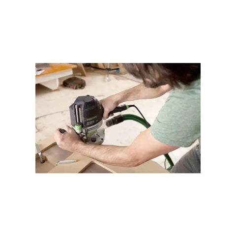 Person using Plunge Router Of 1400 EQ-F-Plus With Ergonomic Grip for precise woodworking on table