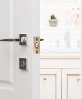 Stunning Golden Roller Latch With Adjustable Tension For Closet Cupboard Door hidden on white door with modern handle.