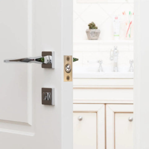 Stunning Golden Roller Latch With Adjustable Tension For Closet Cupboard Door hidden on white door with modern handle.