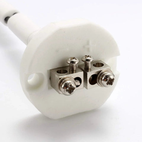Close-up of white ceramic K-type thermocouple block with two metal terminal clamps and screws