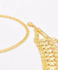 Detail shot of Dope Adjustable Gold Coin Waist Chain For Belly Dance Flexes And Festival Vibes with gold tassels and links.