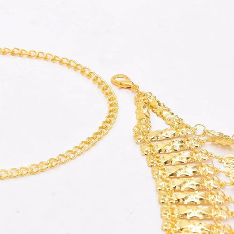 Detail shot of Dope Adjustable Gold Coin Waist Chain For Belly Dance Flexes And Festival Vibes with gold tassels and links.