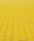 Close-up of yellow wax foundation sheet for beekeeping used in Medium 10 Frame Wax Dipped Fir Wood Langstroth Honey Super.