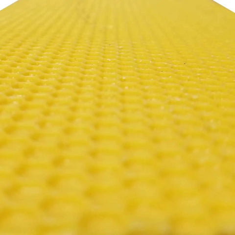 Close-up of yellow wax foundation sheet for beekeeping used in Medium 10 Frame Wax Dipped Fir Wood Langstroth Honey Super.