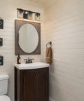 Oil Rubbed Bronze 3 Light Bathroom Vanity Light Fixture With Clear Glass Shades in a modern farmhouse bathroom.