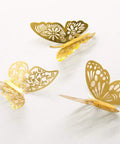 Three gold 3D butterflies from 3D Butterfly Wall Decor Set Featuring Gold, Rose Gold And Silver Butterflies Perfect For Cake Decorating, Party And Wedding Decor Includes 72 Pieces With Double Sided Adhesive Dots For Quick, Standout Accents.