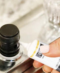 Ultra Gritty Multi Use Silicone Grease For O Rings Plumbing And Rubber Seals used on a threaded black seal in a plumbing fixture.