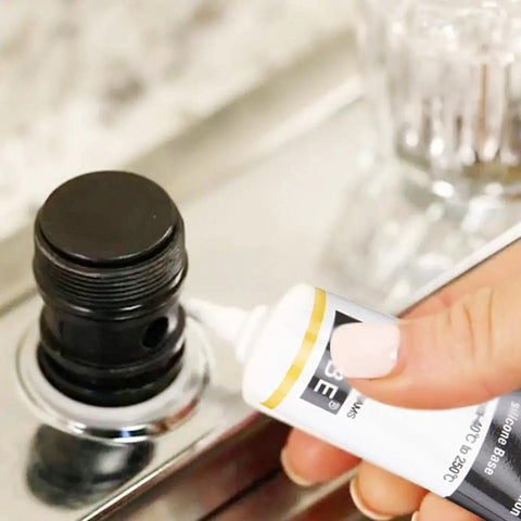 Ultra Gritty Multi Use Silicone Grease For O Rings Plumbing And Rubber Seals used on a threaded black seal in a plumbing fixture.
