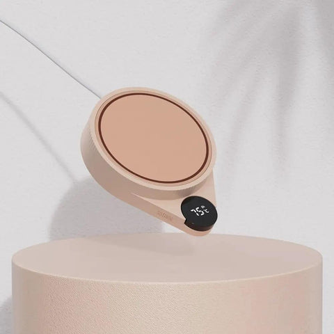 Smart Mug Warmer For Desk Electric Cup Heater With Three Adjustable Temperatures on a sleek beige surface.