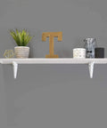 White Powder Coated Shelf Brackets Set 10 Inch By 12 Inch Four Pack Heavy Duty Wall Mount Brackets With 150 Lbs Weight Capacity supporting a shelf.