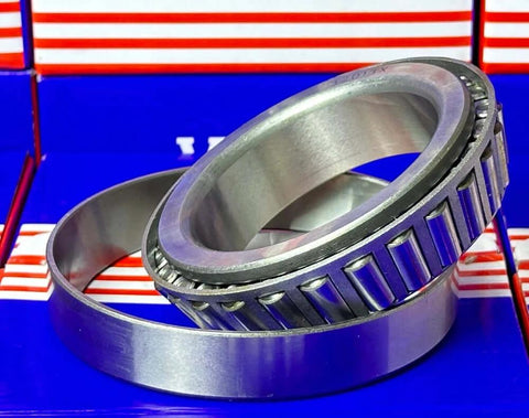 32013 Tapered Roller Wheel Bearing 65x100x23mm made from chrome steel with cone and cup design on colorful packaging background
