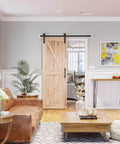 5ft Barn Door Hardware Kit with I shape hanger installed on wooden door in living room, showcasing sliding functionality and design.