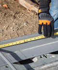 Person using Folding Ruler 6-Foot Fiberglass With Brick Scale On Reverse and Outside Reading One Sixteenth Inch Graduation for metalworking