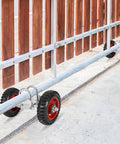 6 Inch Rubber Rolling Gate Wheel With Double U Bolts And Hardware Kit Sliding Gate Rollers For Driveway Gates Chain Link Fence And Metal Tube Gates Stainless Steel Plate 550 Lb Capacity Durable Outdoor Hardware, shown installed on metal gate