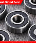 Close-up of Pack of 12 608-2RS sealed ball bearings 8x22x7mm in steel with dual-sided rubber seals on textured surface.