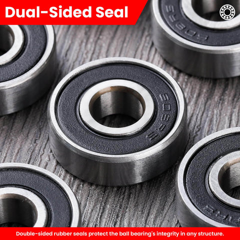 Close-up of Pack of 12 608-2RS sealed ball bearings 8x22x7mm in steel with dual-sided rubber seals on textured surface.