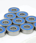 100-Pack 608-2RS Skate Ball Bearings - Blue Seals arranged in a triangle, showcasing blue rubber seals and steel material.