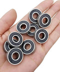 Hand holding 100 PCS 608-2RS Ball Bearing - Double Rubber Sealed Shielded Miniature Deep Groove Bearings for Small Machinery and More