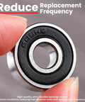 Close-up of 608-2RS sealed ball bearing held between fingers with 'Reduce Replacement Frequency' text overlay