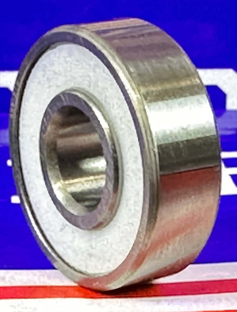 Close-up of 100-Pack Skate/Fidget Bearings - PTFE Seals showing a single bearing with a shiny metal finish.