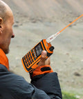 Person using Dual Band Walkie Talkie Antenna For 144 And 430 MHz With SMA Female Connector in outdoor setting
