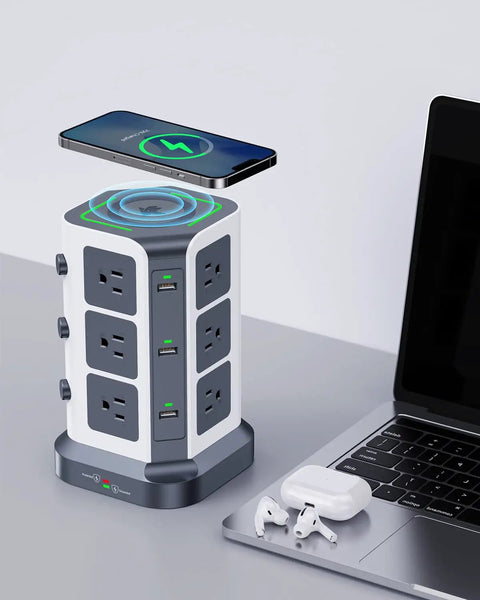 Power Strip Tower With 15W Wireless Qi Charger And Surge Protector, showing 12 AC outlets, 6 USB ports, and a smartphone charging.