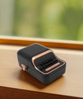 Cool Retro Label Printer With Bluetooth 5.0 Connectivity And Compact Design showing a sleek portable design on a wooden surface.