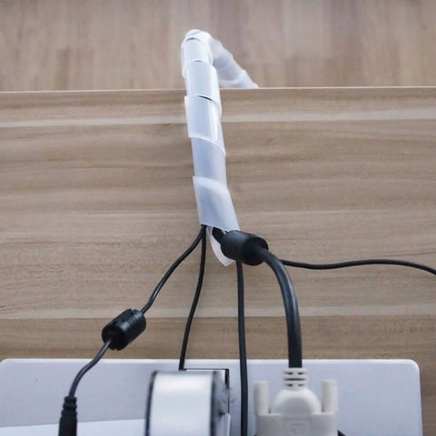 Half Inch 20 Ft Spiral Cable Wrap for wires organizing cords neatly on a desk, showing its flexible flame-retardant PE cover in white.
