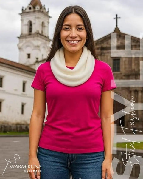Woman wearing Ultra Cozy Winter Cashmere Infinity Scarf in Beige, standing outdoors with church background
